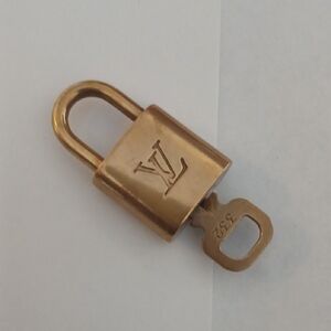 Louis Vuitton Brass-tone LV Engraved Padlock with Key 332